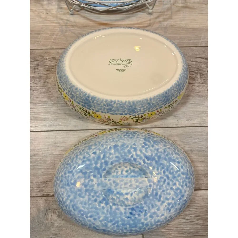 Temp-tations Ovenware by Tara Blue oval covered casserole dish with a metal stan